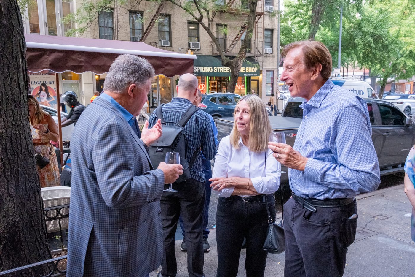 Guests chatting on the sidewalk outside Piccola Cucina