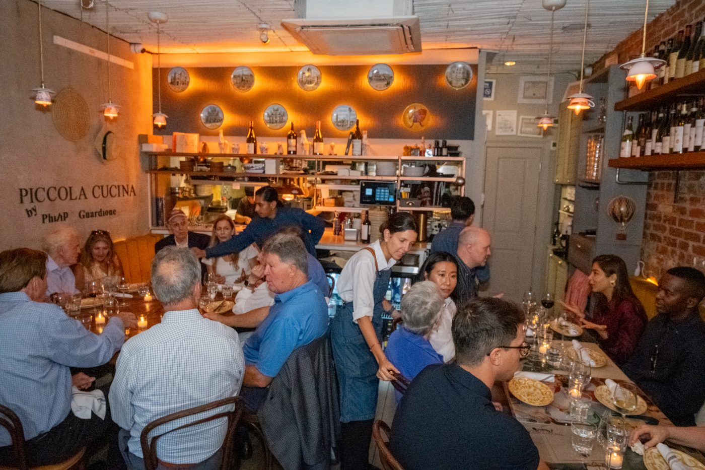 Guests gathered inside Piccola Cucina Osteria Siciliana